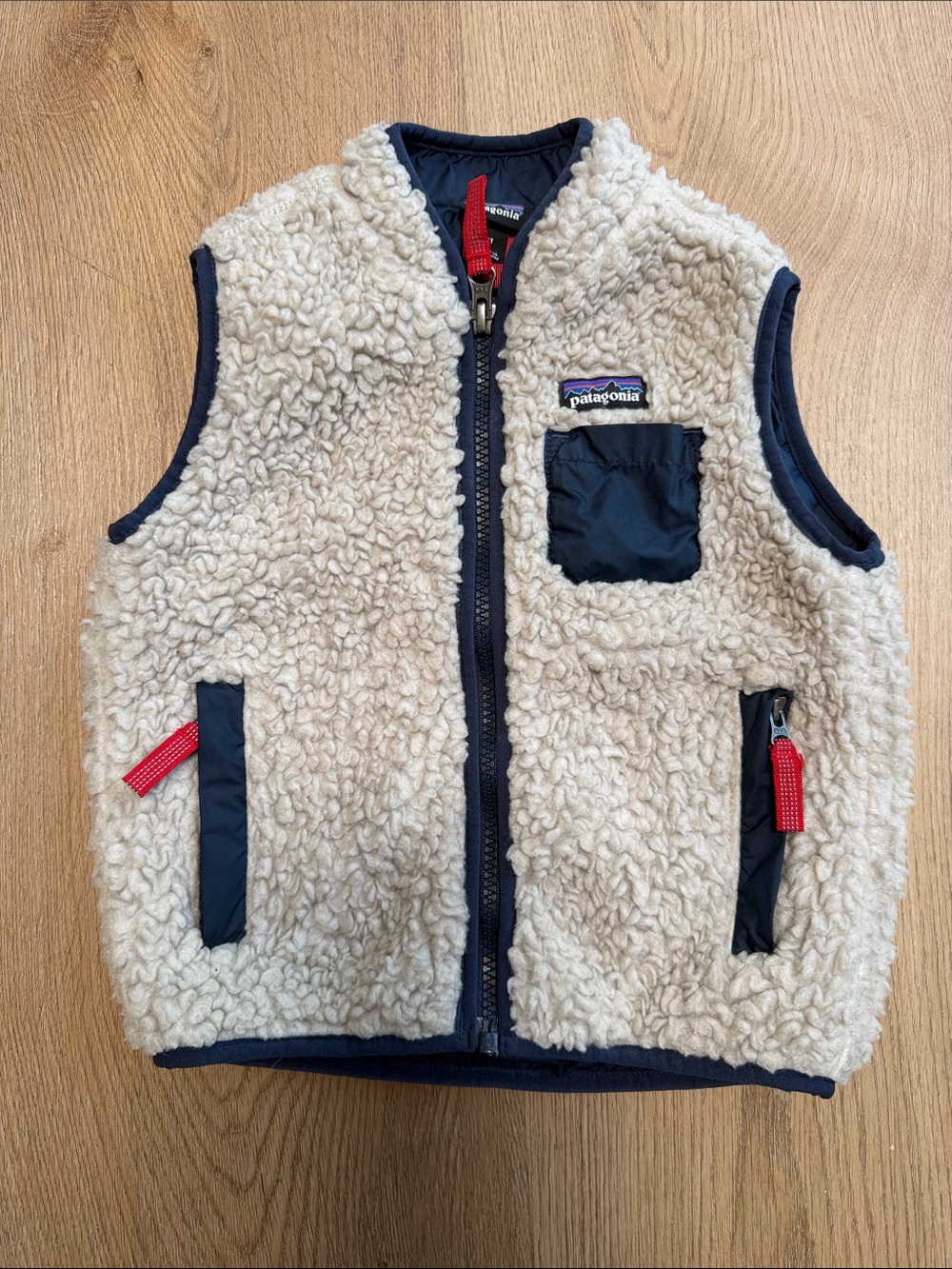 Patagonia Cream Sherpa Vest with Navy Accents and Red Zips